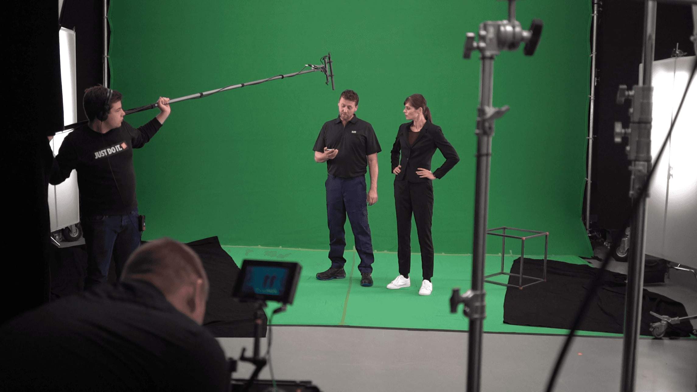 Film shoot in the UP Designstudio green screen studio with camera and boom microphone