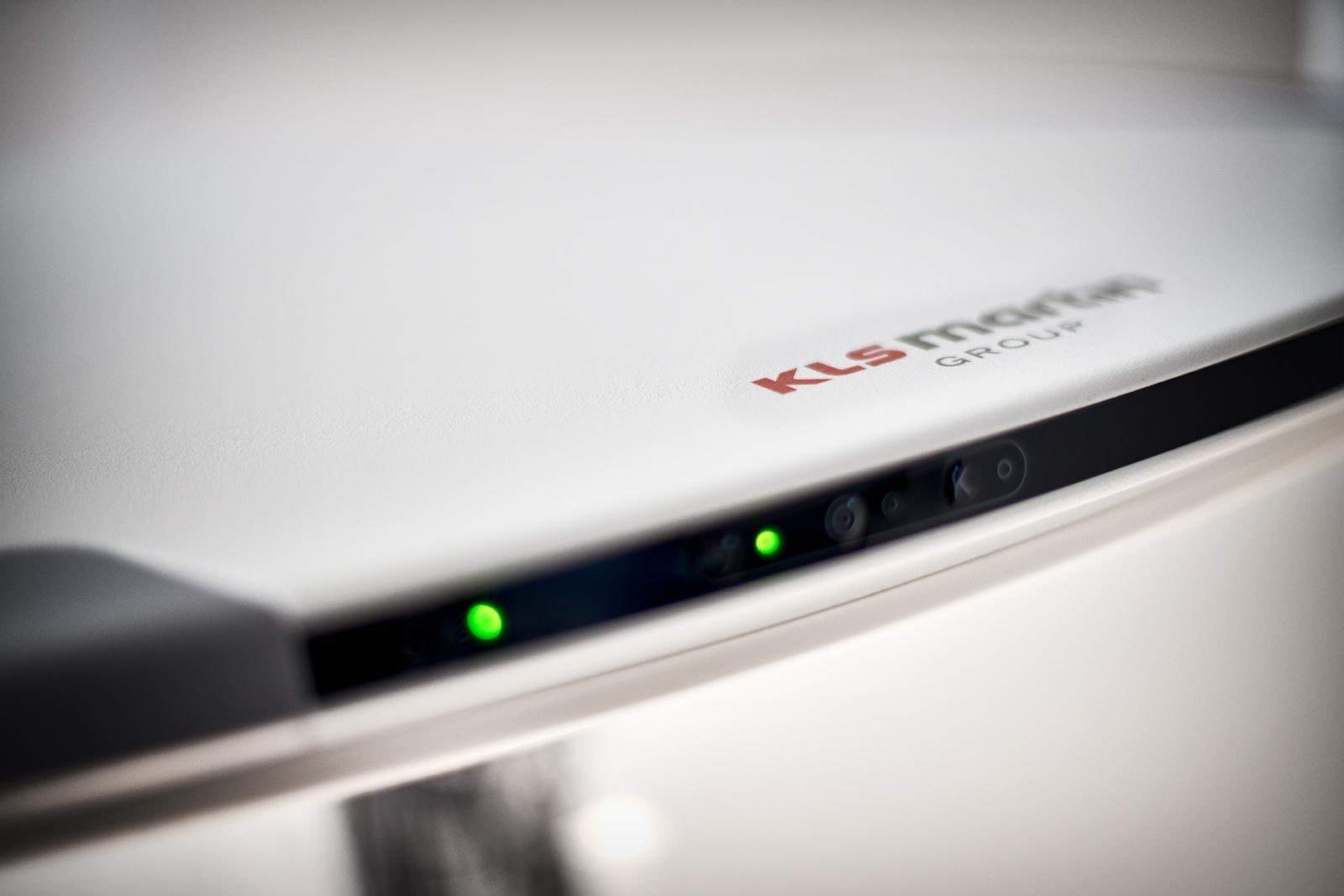 Close-up of the marLED X housing edge with the KLS Martin logo and green status lights